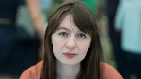Sally Rooney claims she cannot enter the UK over potential arrest